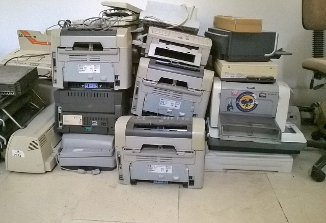 Old printers being prepared for the tip